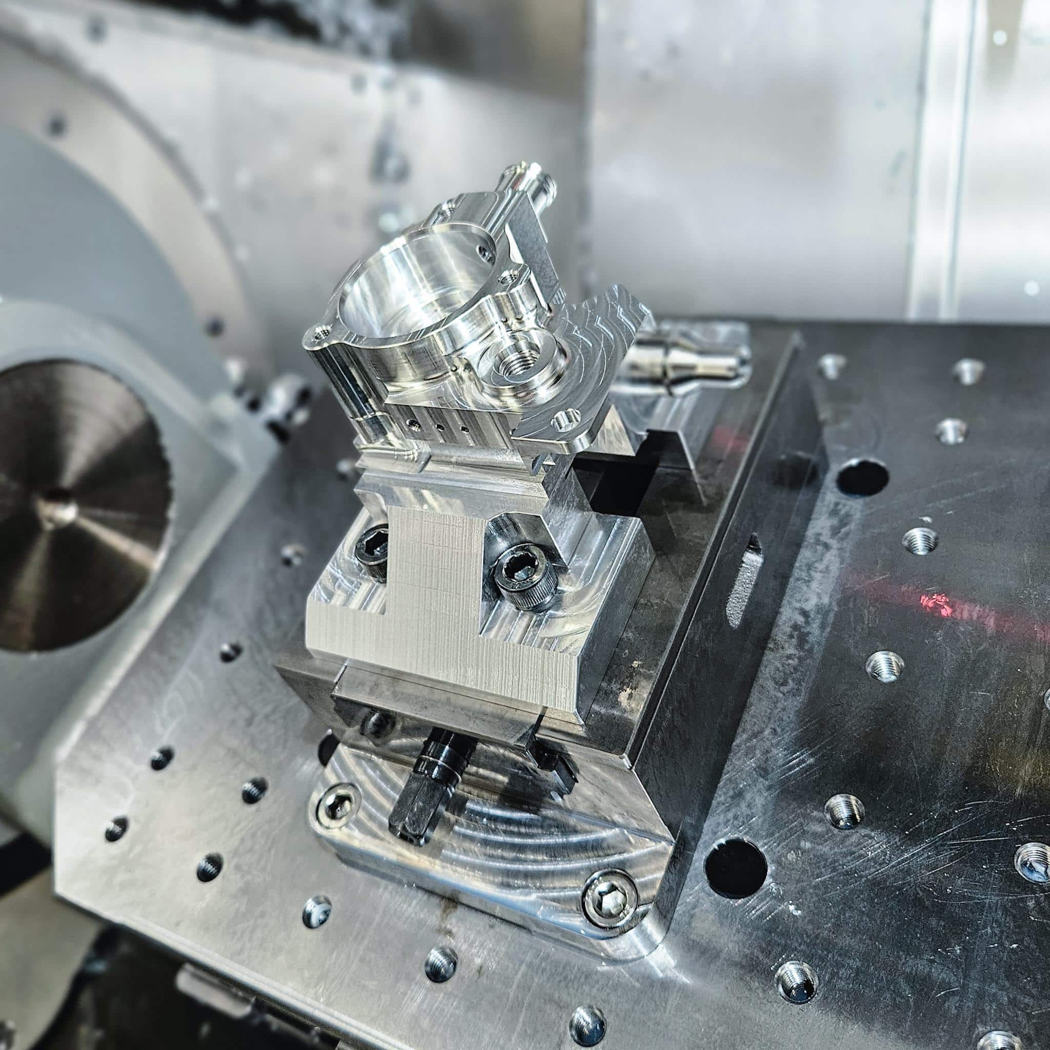 Close of up precision cnc machined part on 5-axis table